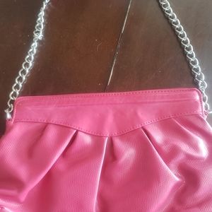 Oversized pink clutch